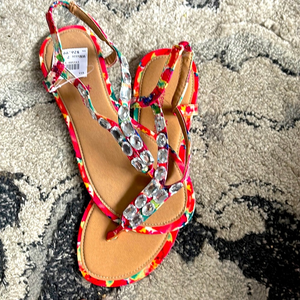 Never worn still has tags on them. Pink beads sandals size 7